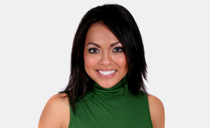 Brunette girl wearing a green turtleneck