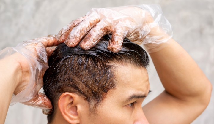 Man who is coloring his hair