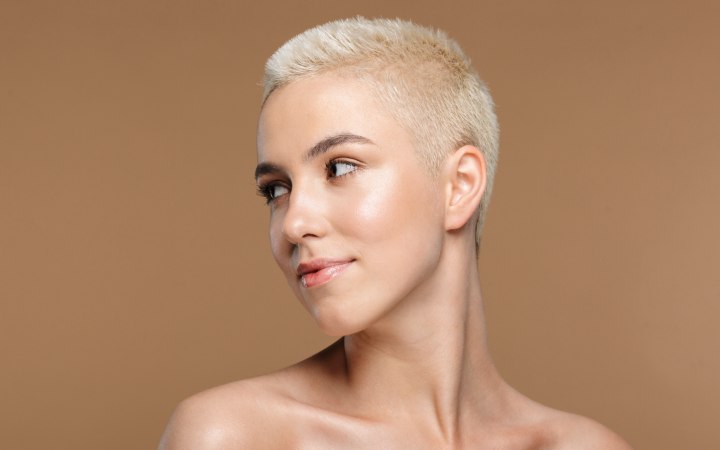Woman with very short hair and a healthy skin