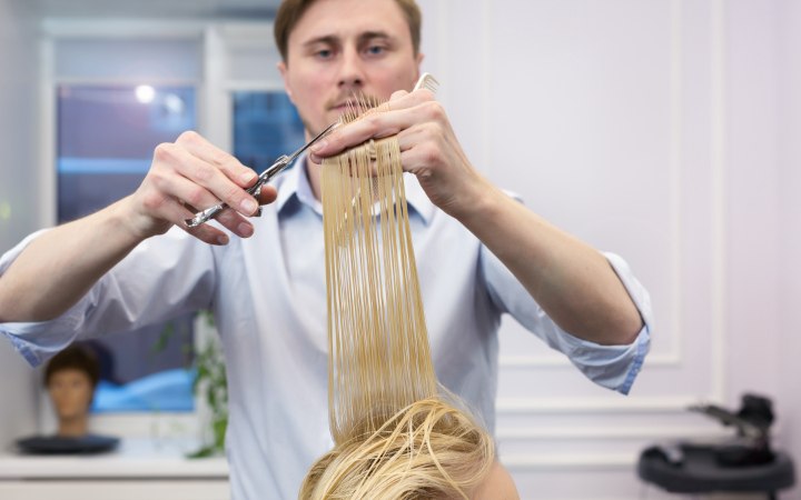 Hair stylist cutting split ends