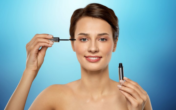 Woman who is applying mascara