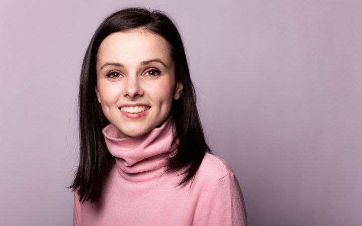 Girl wearing a pink turtleneck shirt