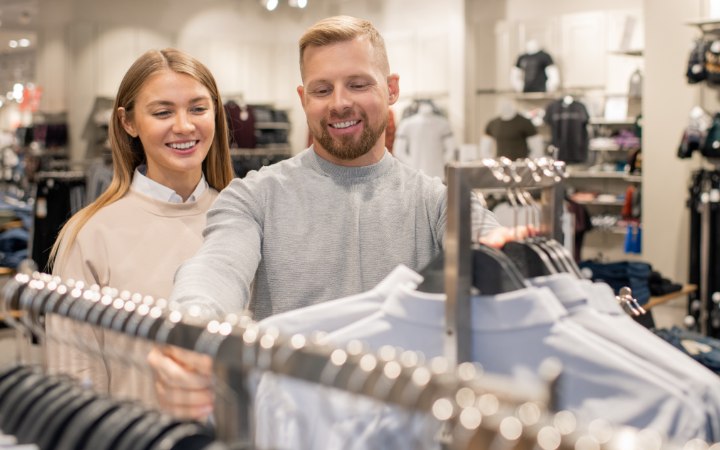 Man and woman shopping for clothes