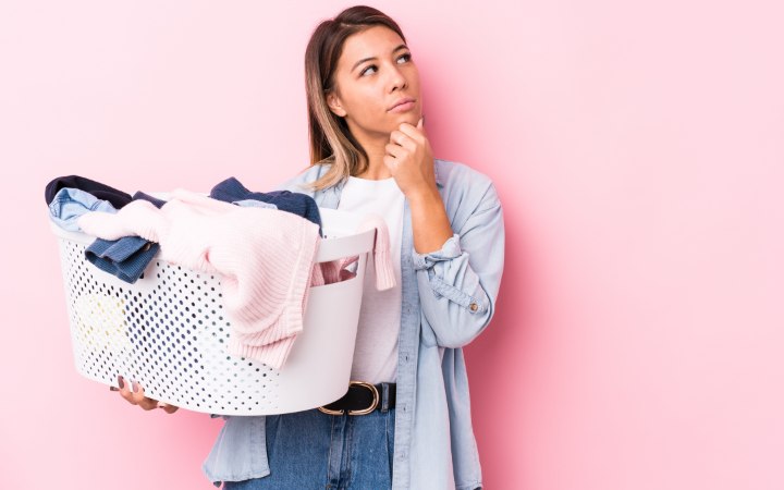 Woman wondering about how to take care of clothing